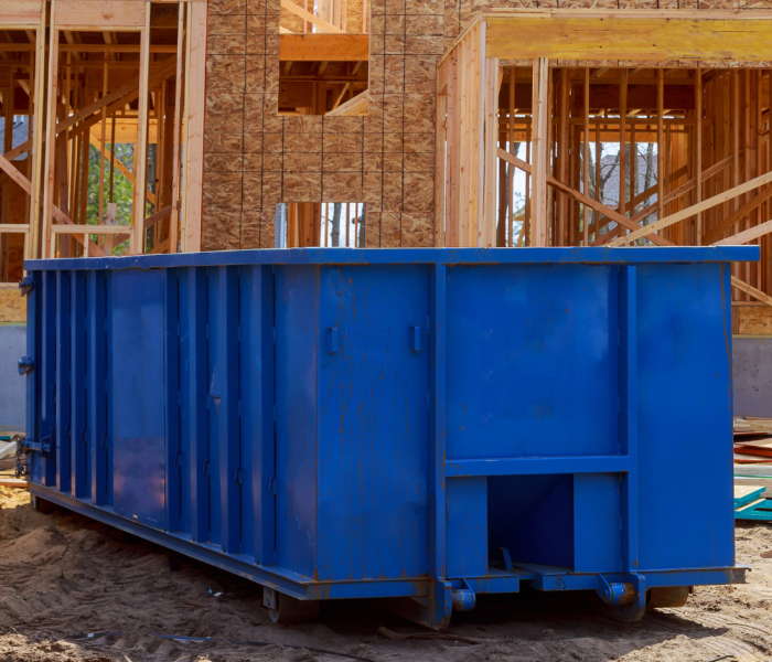 dumpster rental clermont fl being used for a construction project.